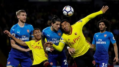 Troy Deeney, second right, was ruthless against Arsenal - on and off the pitch. Paul Childs / Reuters