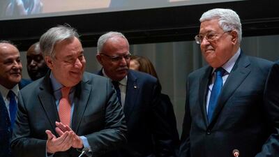 Palestinian president Mahmud Abbas (R) is applauded by the United Nations Secretary General Antonio Guterres during meeting of the United Nations Group of 77. AFP