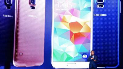 Chief executive and president of Samsung JK Shin presents the new Samsung Galaxy S5 during the first day of the Mobile World Congress 2014 in Barcelona. David Ramos / Getty Images