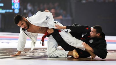Faisal Al Ketbi, right, is one of the UAE's finest ever jiu-jitsu fighters. Victor Besa / The National