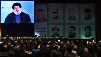 Hizbollah leader Hassan Nasrallah, speaks via video link to his supporters during a ceremony marking the death of six Hizbollah fighters and an Iranian general who were killed in an Israeli airstrike in Syria’s Golan Heights last week, in the southern suburb of Beirut on January 30. Bilal Hussein / AP Photo