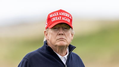 Former US president Donald Trump plays a round of golf at his Turnberry course in Scotland on May 2. Getty