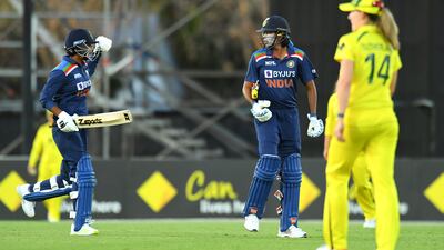 Meghna Singh and Jhulan Goswami, right, celebrate after guiding India to victory in the third ODI against Australia at the Great Barrier Reef Arena in Mackay on Sunday, September 26, 2021. Getty