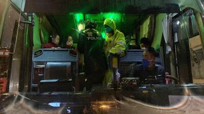 Police officers carry out information registration and temperature measurement for passing passengers at Jintang Island high-speed toll station in Zhoushan, Zhejiang Province, China. EPA