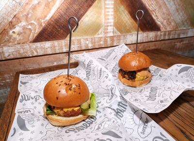 A comparison between the vegan burger (left) and the beef burger, now served at Bareburger. Chris Whiteoak / The National