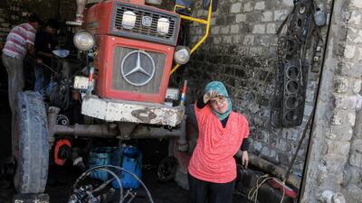 She works on vehicles such as tractors. Reuters