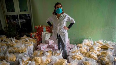 Moroccan volunteers of local organisation National Institute for Solidarity with Women in Distress prepare food donations to be distributed in Casablanca on April 8. Fadel Senna/ AFP
