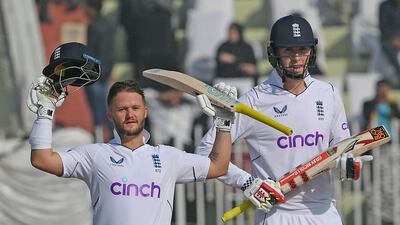 England's Ben Duckett, left, celebrates after scoring a century with teammate Zak Crawley during the first day of the first Test against Pakistan in Rawalpindi on Thursday, December 1, 2022. AFP