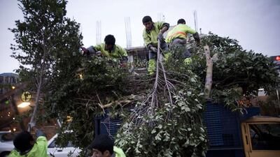 About 90 minutes after the initial storm, the winds appeared to ease and more cars were seen on the streets, although many people opted to stay inside office buildings. Behrouz Mehri/AFP Photo