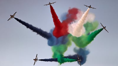 Members of Al Fursan aerobatics demonstration team of the UAE perform a fly-over at the Dubai Airshow. EPA