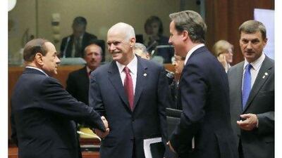 Prime ministers, from left, Italy's Silvio Berlusconi, Greece's George Papandreou, Britain's David Cameron and Estonia's Andrus Ansip chat at the start of an European Union leaders summit in Brussels yesterday. Reuters