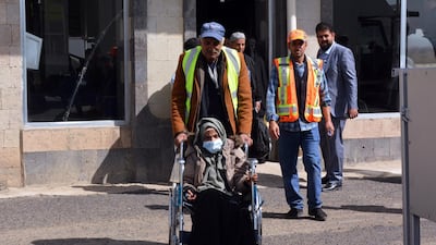 An airport worker pushes a sick Yemeni in a wheelchair before boarding a UN medical evacuation plane at Sana'a airport, Yemen. EPA