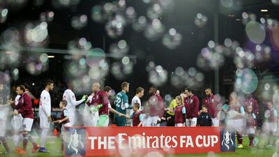 Liverpool shakes hands with West Ham after a loss. (Reuters/Matthew Childs)