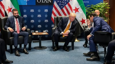 US Secretary of State Marco Rubio speaks to President Donald Trump during a meeting with Syrian President Ahmad Al Shara. Reuters