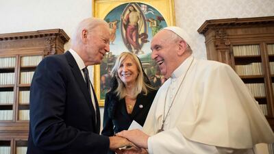 Pope Francis and US President Joe Biden shake hands during a private audience at The Vatican. AFP