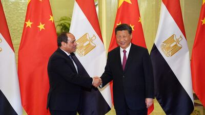 Egypt President Abdel Fattah El Sisi (L) shakes hands with President of the People's Republic of China Xi Jinping (R) as they meet at the Great Hall of People in Beijing on April 25, 2019. AFP