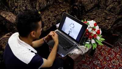 Karim Asir watches a Charlie Chaplin movie. Reuters