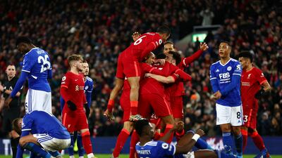 Diogo Jota is mobbed by teammates after scoring Liverpool's second goal. Getty