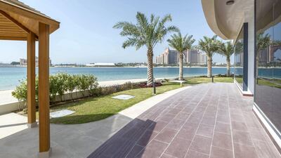 Residents can soak up the sun on the patio. Courtesy LuxuryProperty.com