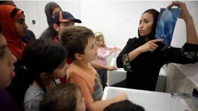 Fatima Ghazal leads a children's educational workshop after the trip. Sammy Dallal / The National