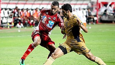 Champions Al Jazira and Dubai Club comepte in a Pro League match last season. The UFL's operating powers have been dissolved and handed to the Football Association.