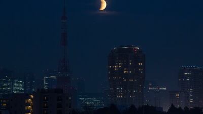 The partial lunar eclipse over Tokyo Tower in Japan. AP Photo