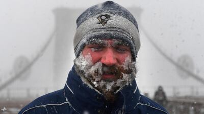 A pedestrian walks across the Brooklyn Bridge. Darren Ornitz / Reuters