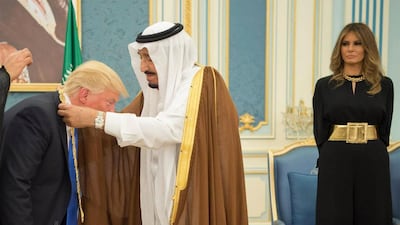 First Lady Melania Trump looks on as her husband, US president Donald Trump receives the Order of Abdulaziz Al Saud medal from Saudi Arabia’s King Salman. Photo by Saudi Press Agency