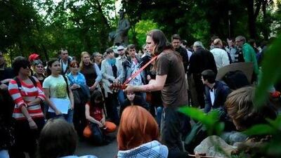 Activists gather around a musician at an anti-government protest camp in central Moscow earlier this month. Natalia Kolesnikova / AFP