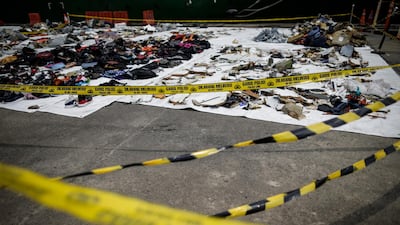 Police cordon off the recovered debris.