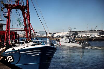 The French Gendarmerie patrol boat 'Athos' leaves as British trawler 'Cornelis' is seen moored in the port of Le Havre. Reuters