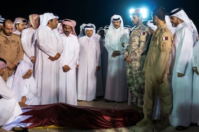 Qatari Emir Sheikh Tamim attends the funeral of armed forces personnel killed in the helicopter crash. Reuters