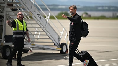 Jurgen Klopp boards the plane at John Lennon Airport. AFP
