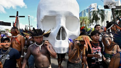 A skull sculpture is carried on a march for indigenous rights to the Brazilian National Congress building during the annual Terra Livre encampment in Brasilia. AFP