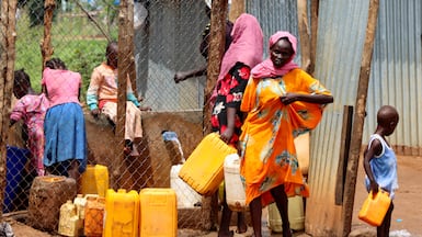 Sudanese refugees collect water from a tap at the Gorom Refugee camp near Juba, in South Sudan. Reuters