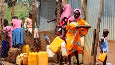 Sudanese refugees collect water from a tap at the Gorom Refugee camp near Juba, in South Sudan. Reuters