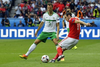 Jonny Evans, left, in action for Northern Ireland against Gareth Bale and Wales at Euro 2016. AFP
