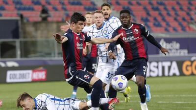 Bologna's Riccardo Orsolini and Inter's Nicolo Barella in action. EPA