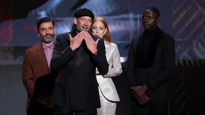 Troy Kotsur receives the award for Outstanding Performance by a Male Actor in a Supporting Role for 'Coda'. Reuters