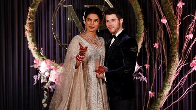 Newlyweds Priyanka Chopra, 36, and Nick Jonas, 26, pose for a photograph during a reception at a hotel in New Delhi on December 4, 2018. Photo: Reuters