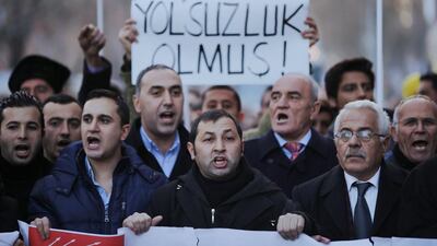 Demonstrators protest against Turkey's ruling Justice and Development Party and demand the resignation of Prime Minister Tayyip Erdogan in Ankara on Saturday. The banner reads "Corruption is your way". Umit Bektas / Reuters