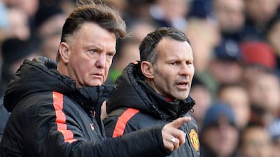 Manchester United manager Louis Van Gaal, with assistant Ryan Giggs, watches his side during their Premier League draw with Tottenham Hotspur on Sunday. Andy Rain / EPA / December 28, 2014