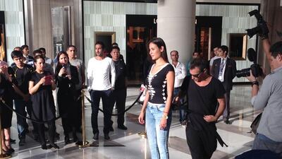 Adam Saaks performs a demonstration of his T-shirt cutting skills on a model at The Galleria on Al Maryah Island on September 26, 2014. Evelyn Lau / The National