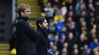 Liverpool manager Jurgen Klopp, left, and Watford counterpart Quique Sanchez Flores look on during the match. Ben Stansall / AFP