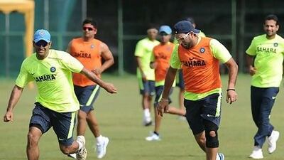 MS Dhoni, left, says his fellow India cricketers are always playing under pressure, and matches against Pakistan do not add to it. Lakruwan Wanniarachchi / AFP