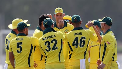 Ashfaq Ahmed of the UAE (not shown) has his wicket taken by Nathan Coulter-Nile of Australia.