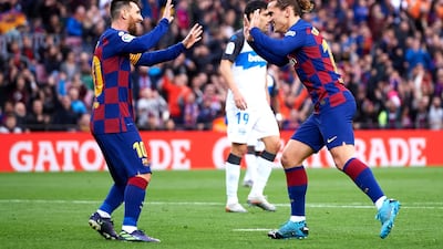 Antoine Griezmann celebrates with Lionel Messi after scoring the opening goal. Getty