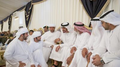 Sheikh Mohammed bin Zayed, Crown Prince of Abu Dhabi and Deputy Supreme Commander of the Armed Forces, fourth right, offers condolences to the family of martyr Hadif Humaid Al Shamsi. Mohammed Al Hammadi / Crown Prince Court - Abu Dhabi