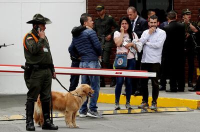 Families waited for information about their relatives at the entry of the Escuela General Santander de la Policia in the wake of the attack. EPA
