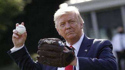 US President Donald Trump throws a baseball on the South Lawn of the White House in Washington to celebrate opening day of the Major League Baseball season. Bloomberg